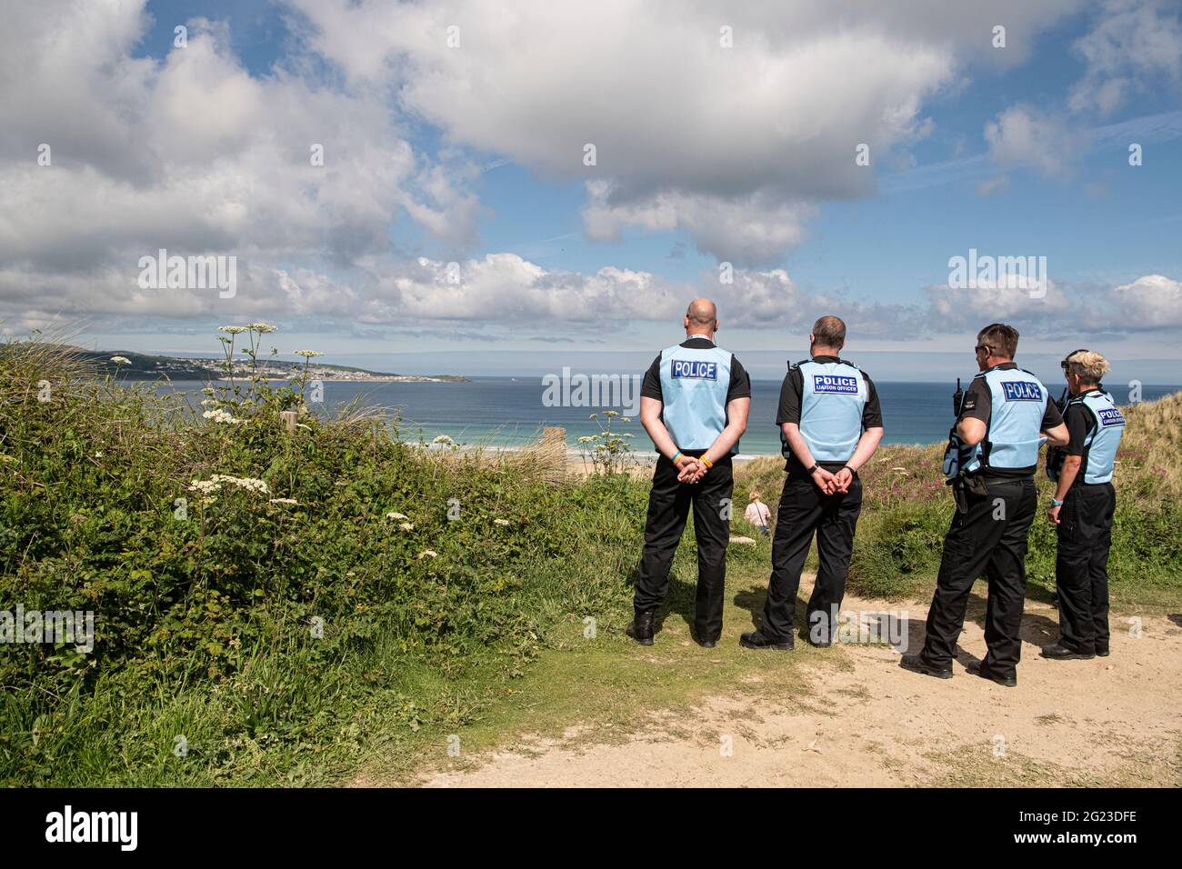 G7 MountRecyclemore 'Mount Rushmore', sculpture made,electronic waste is built on a beach in Carbis Bay Cornwall. Looking over the G7 summit, The seven faces definitely look like the world leaders who will be attending the G7 Summit this week. UK Prime Minister Boris Johnson, Japanese Prime Minister Yoshihide Suga, France's president Emmanuel Macron, Italian Prime Minister Giuseppe Conte, Canadian Prime Minister Justin Trudeau, German Chancellor Angela Merkel and US President Joe Biden. The artists behind the project is Joe Rush, Alex Wreckage international He is using old electrical items Stock Photo