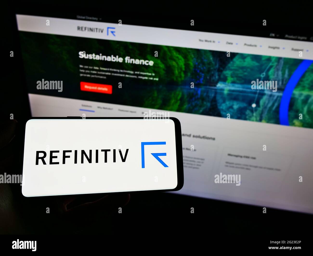 Person Holding Mobile Phone With Logo Of Financial Markets Data Comapny Refinitiv Limited On Screen In Front Of Web Page Focus On Phone Display Stock Photo Alamy
