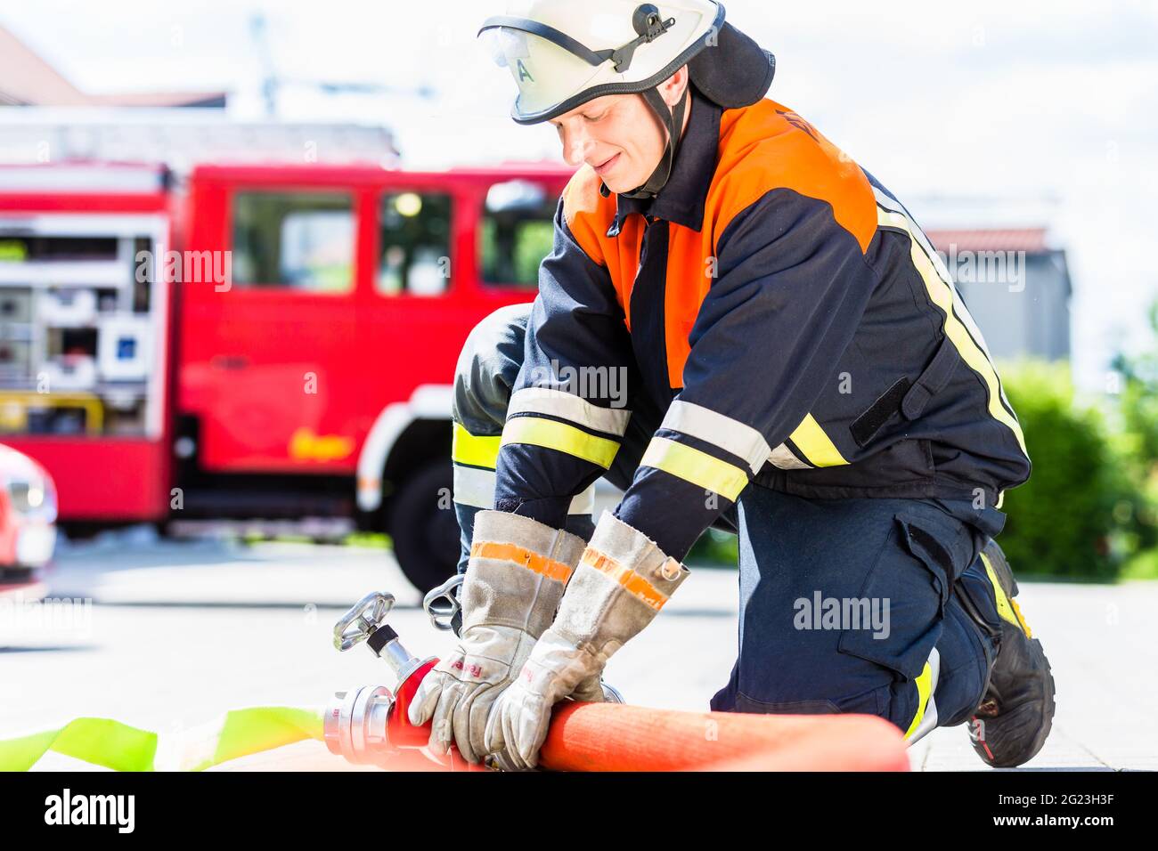 Fire department brigade action water hose hoses hi-res stock ...