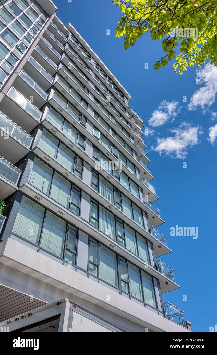 Facade of new residential building on blue sky background Stock Photo ...