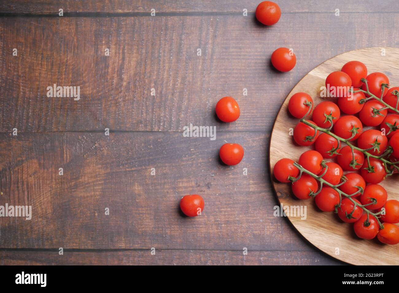 red color cherry tomato on chopping board with copy space Stock Photo ...