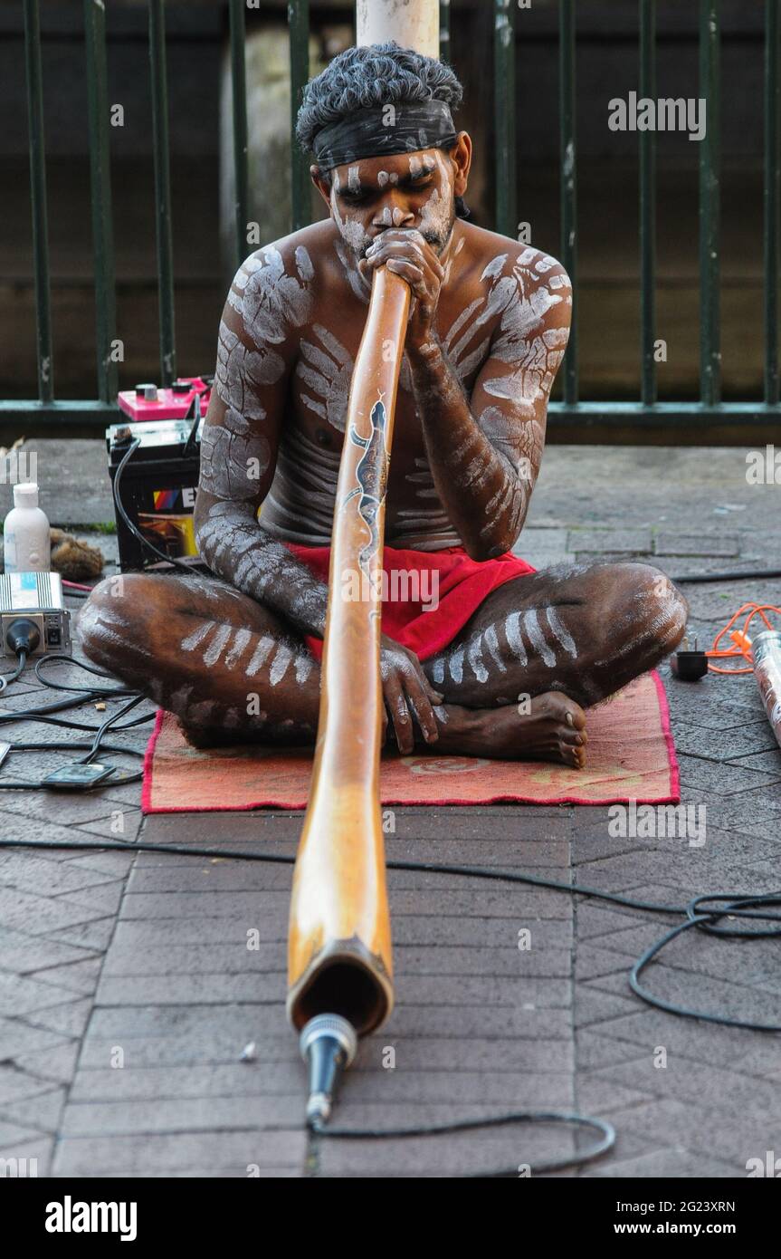 Australian Aboriginal performing a street performance with traditional wind in Harbor Stock Photo - Alamy