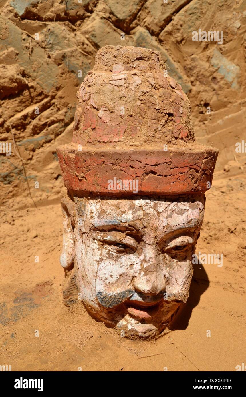 (210608) -- XI'AN, June 8, 2021 (Xinhua) -- File photo taken on May 18, 2020 shows a clay statue unearthed from the remains of the Qingpingbao castle, located in Jingbian County, Yulin City of northwest China's Shaanxi Province. The remains of a Great Wall castle dating back to the Ming Dynasty (1368-1644) were discovered in northwest China's Shaanxi Province, said the Shaanxi Academy of Archaeology Tuesday.   Architectural relics, including two courtyards, were found at the remains of the Qingpingbao castle. (Xinhua) Stock Photo