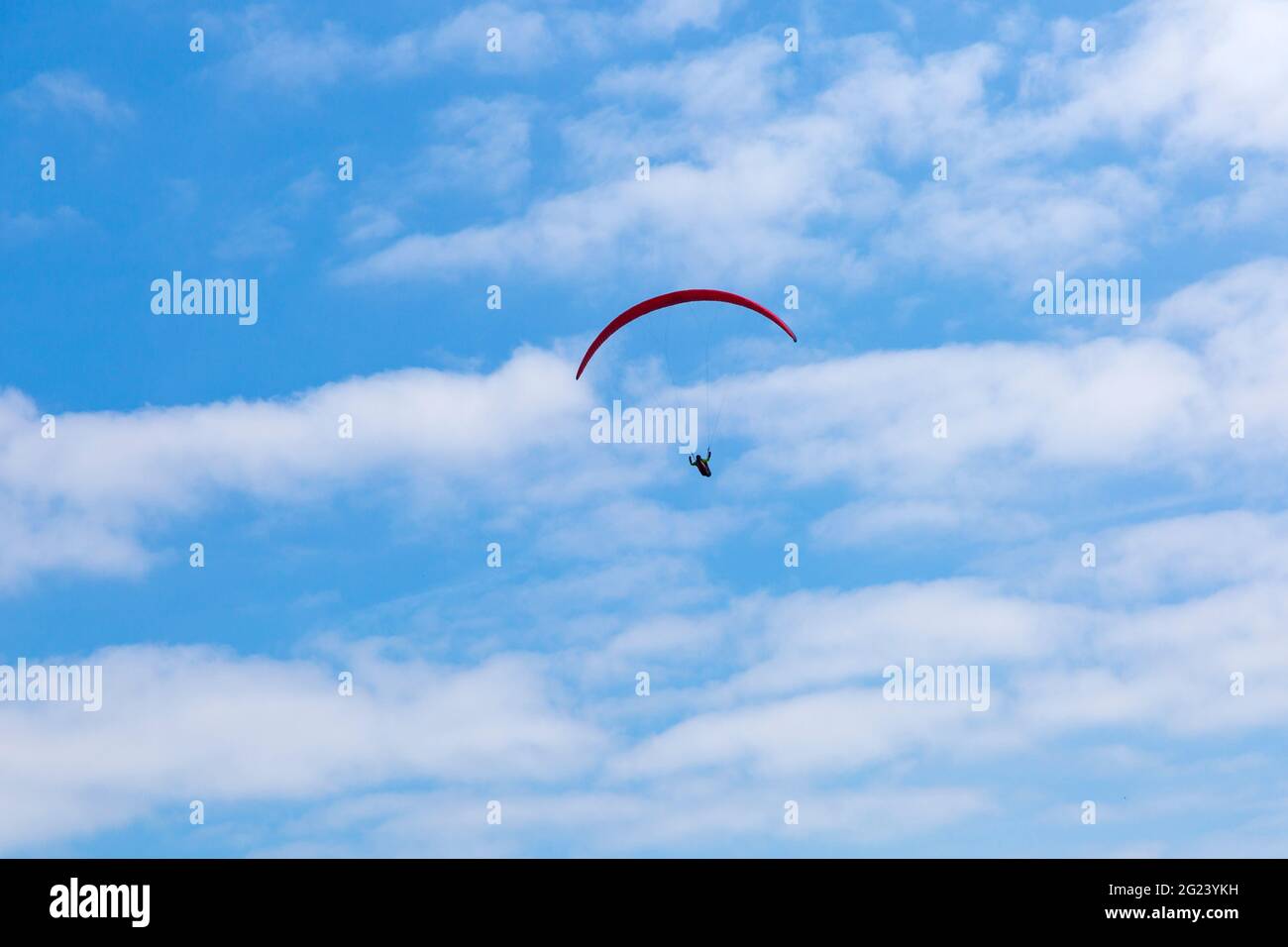 Bournemouth, Dorset UK. 8th June 2021. UK weather: hot and sunny afternoon at Bournemouth beaches, as sunseekers head to the seaside to enjoy the sunshine. Perfect weather for paragliding, riding on the thermals. Credit: Carolyn Jenkins/Alamy Live News Stock Photo