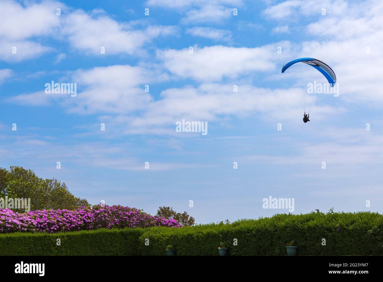 Bournemouth, Dorset UK. 8th June 2021. UK weather: hot and sunny afternoon at Bournemouth beaches, as sunseekers head to the seaside to enjoy the sunshine. Perfect weather for paragliding, riding on the thermals. Credit: Carolyn Jenkins/Alamy Live News Stock Photo