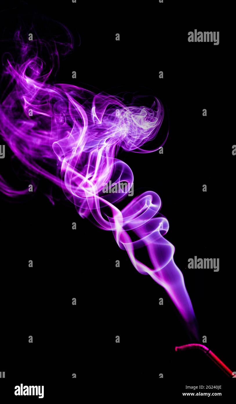 purple smoke on a black background Stock Photo