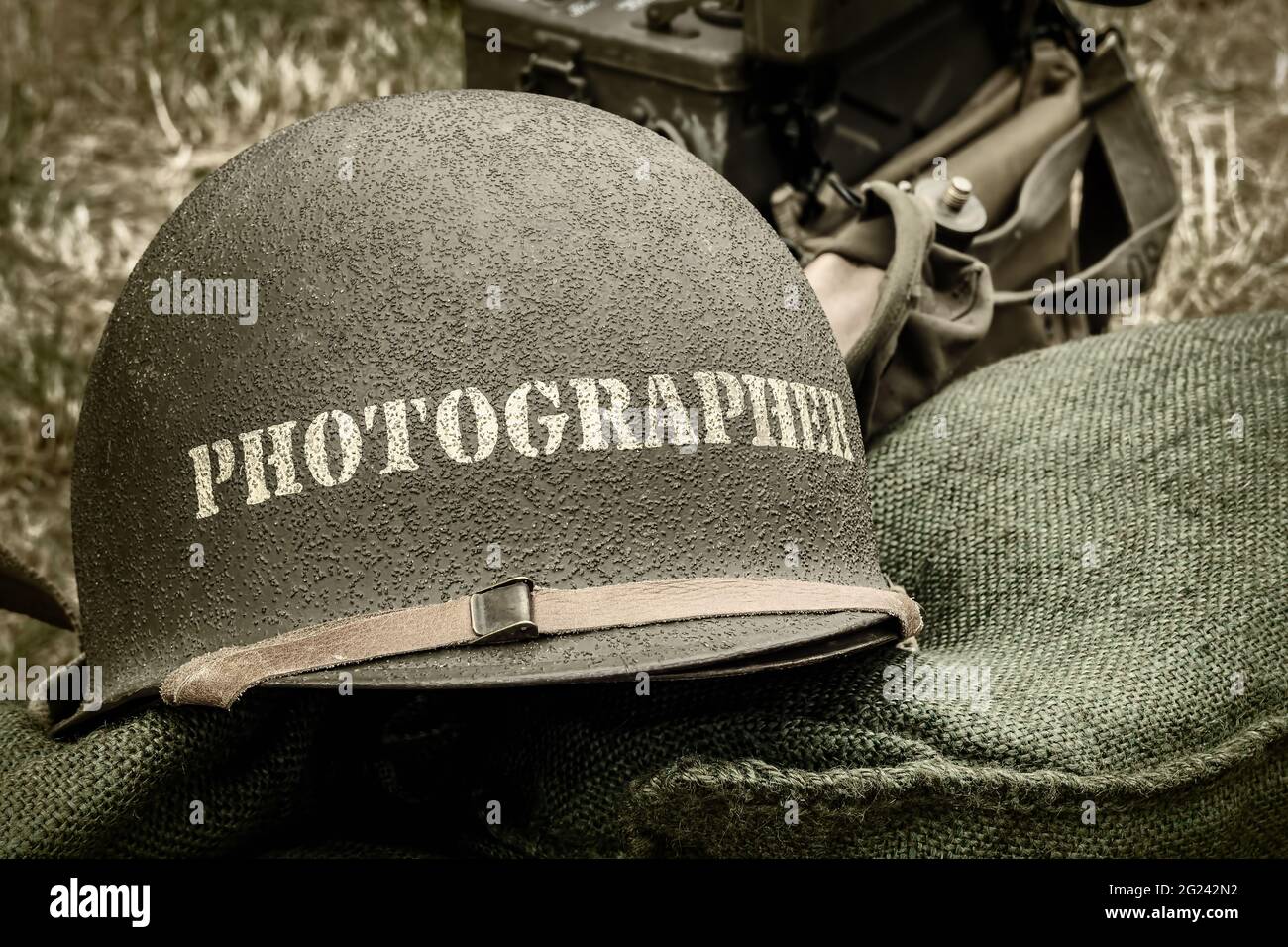 Retro styled image of an old helmet of a war photographer Stock Photo