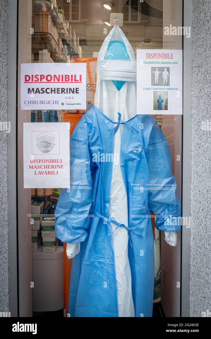 Milan - COVID-19 curiosity- The Senato pharmacy in Corso Venezia displayed a disposable surgical gown with impermeable coveralls. The head is a balloo Stock Photo