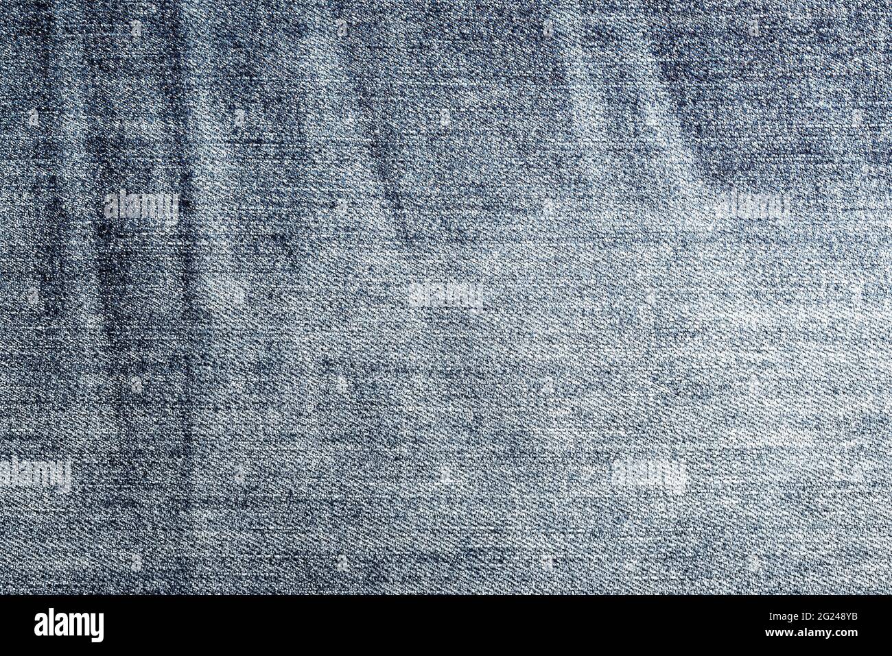 close-up view of worn blue denim fabric, full-frame background Stock Photo