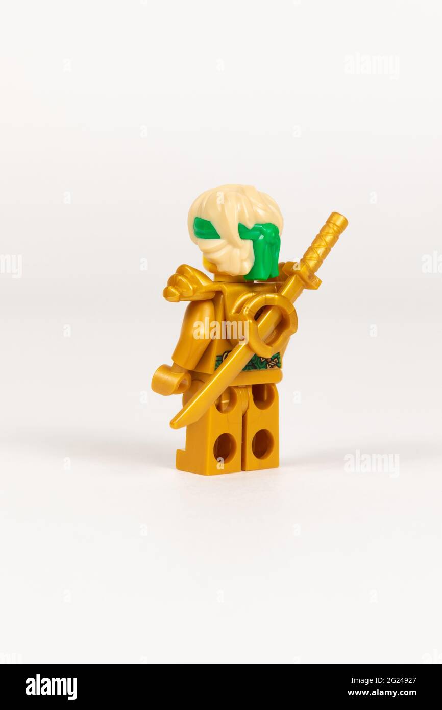 Yekaterinburg. Russia. 04.08.2021. Toy hero Lloyd in a gold kimono with a  sword from a set of lego ninjago on a white background. close-up. selective  Stock Photo - Alamy