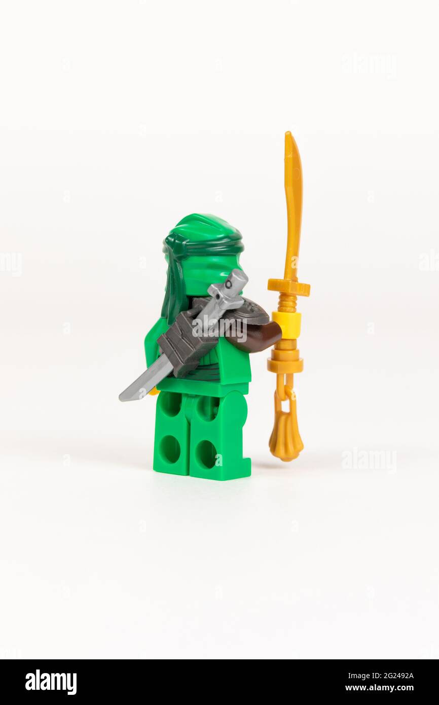 Yekaterinburg. Russia. 04.08.2021. Toy hero Lloyd in a green kimono with a  sword from a set of Lego ninjago on a white background. close-up. selective  Stock Photo - Alamy