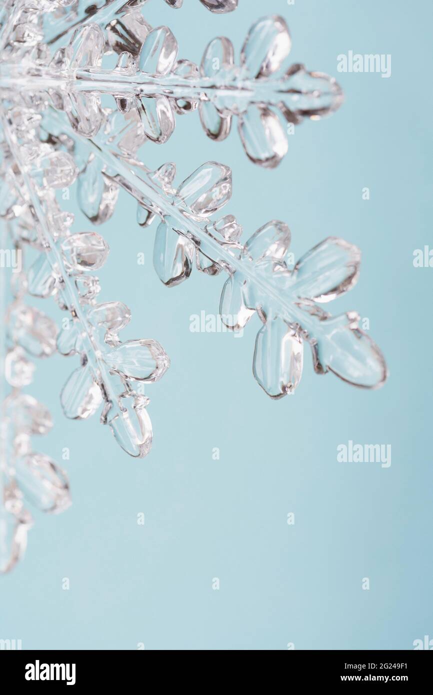 Close-up of snowflake on light blue background Stock Photo - Alamy