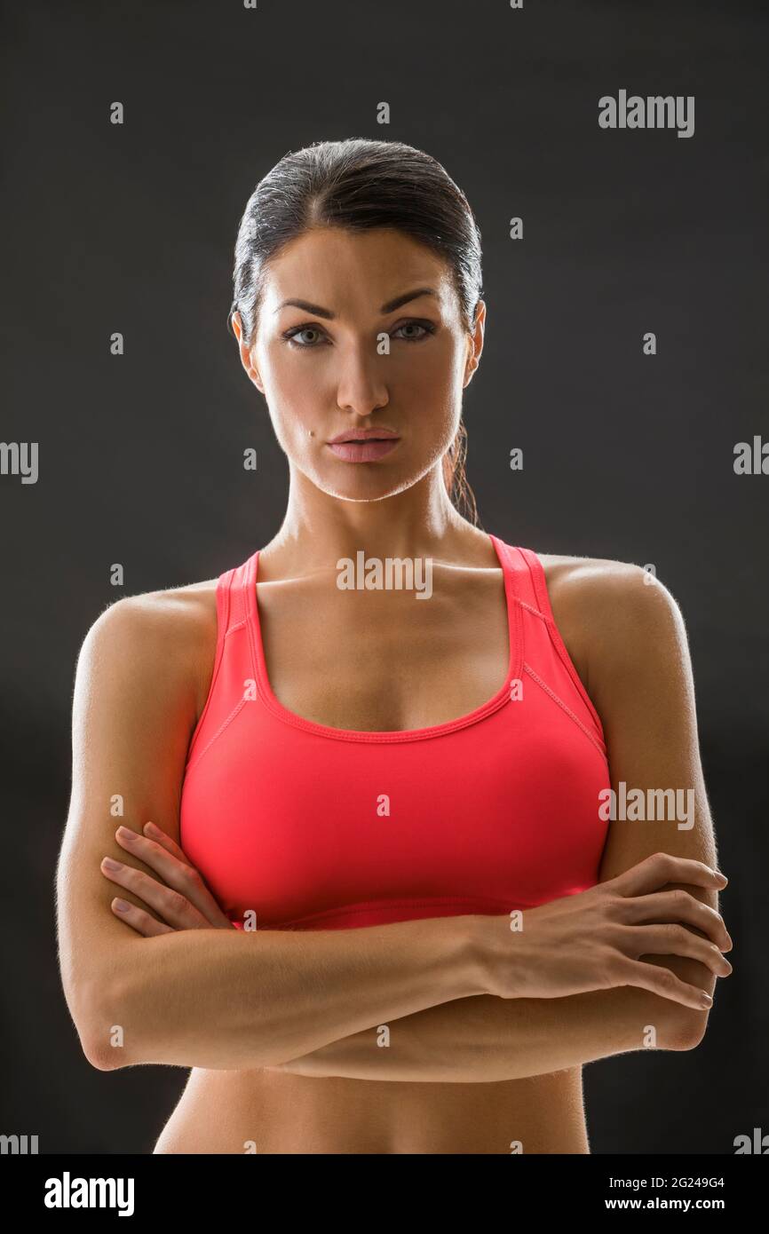 Studio portrait of woman in sports bra Stock Photo