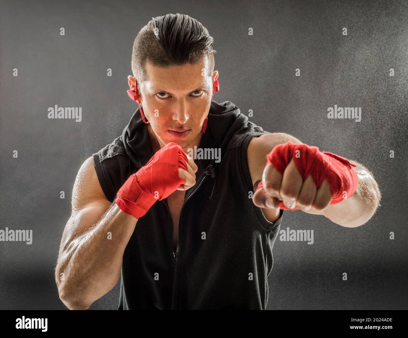 Portrait of muscular man in boxing stance Stock Photo - Alamy