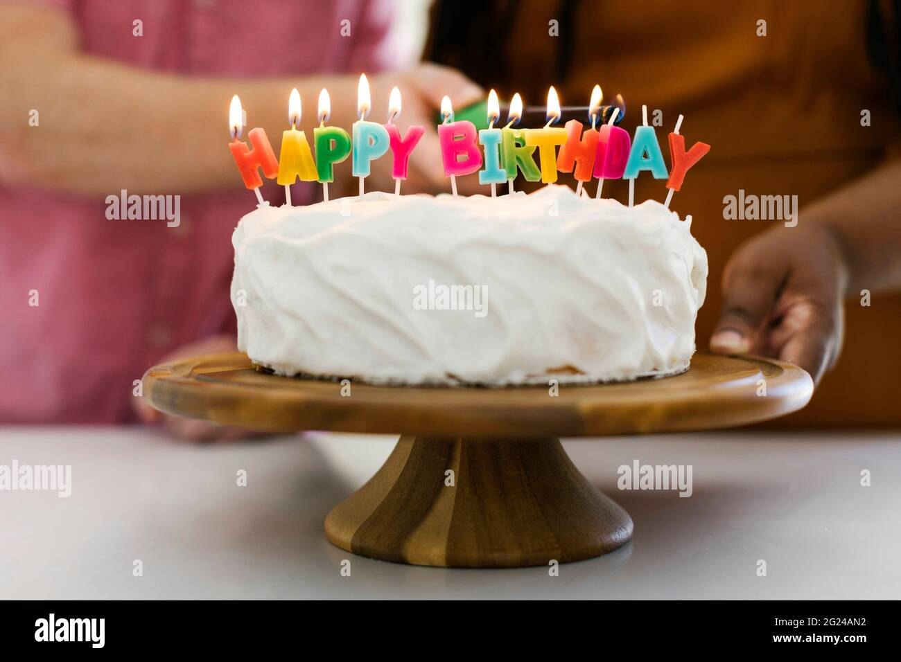 Birthday cake with candles on cakestand Stock Photo Alamy