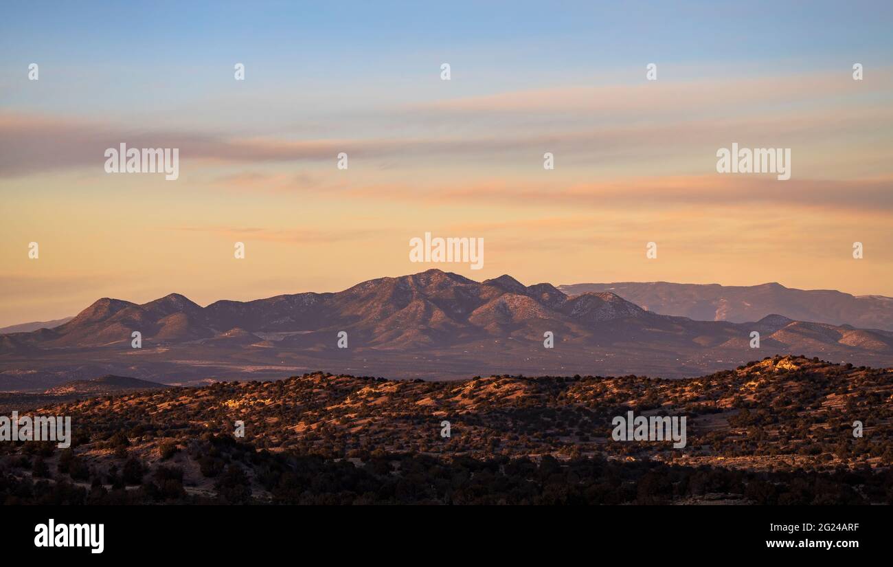 SUNRISE OVER THE SANDIA MOUNTAINS FROM GALISTEO BASIN PRSEERVE, LAMY, NM, USA Stock Photo