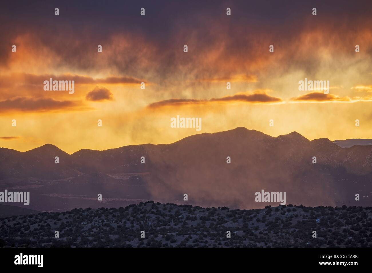 COLORFUL SKY OVER THE SANDIA MOUNTAINS, FROM GALISTEO BASIN PRESERVE, NM, USA Stock Photo