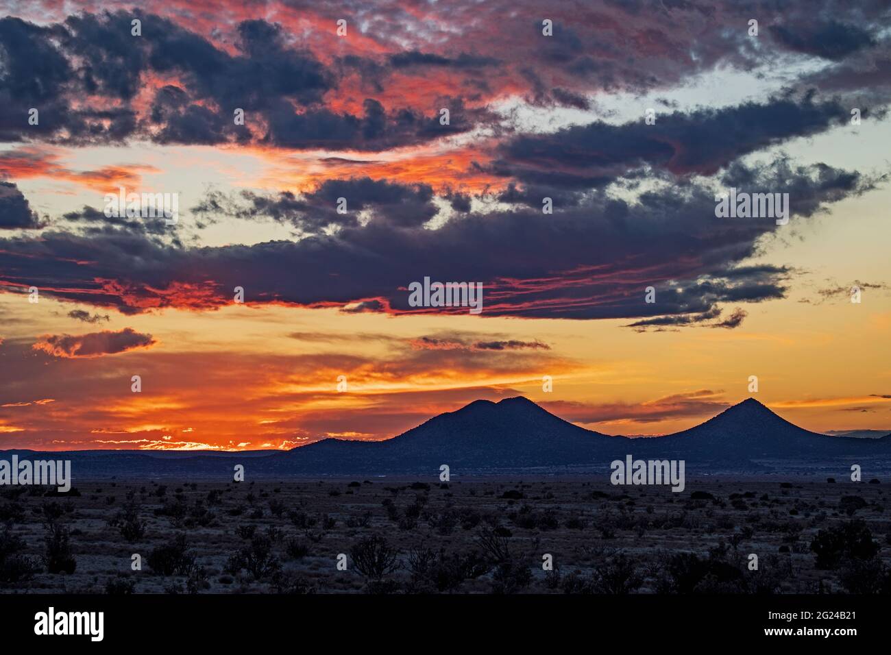 COLORFUL SKY OVER THE CERRILLOS FROM EL DORADO, NEW MEXICO, USA Stock