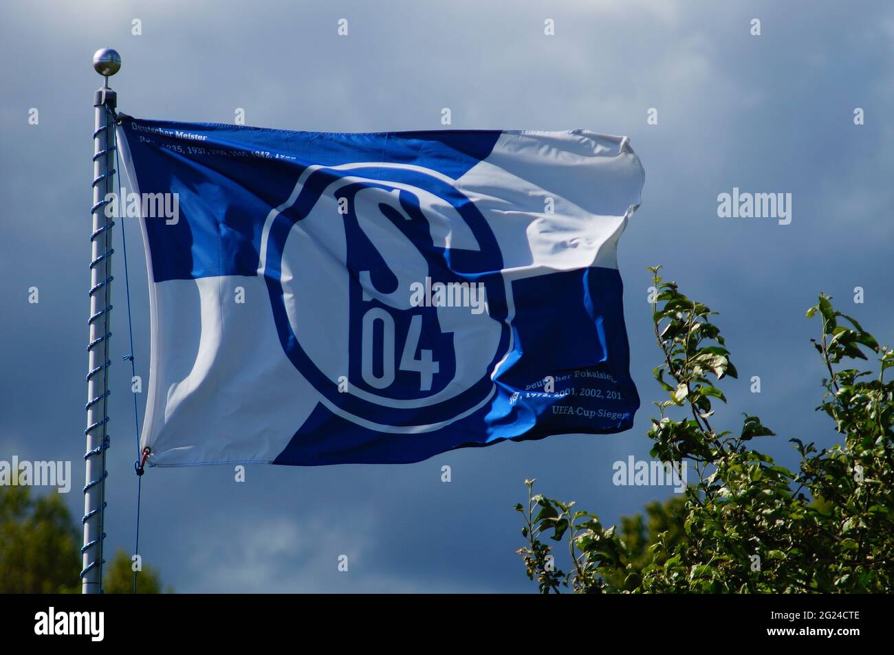 FRANKFURT, GERMANY - May 23, 2021: A Schalke 04 flag flies in an allotment garden in Frankfurt. After 30 years in the 1st Bundesliga, relegation to th Stock Photo
