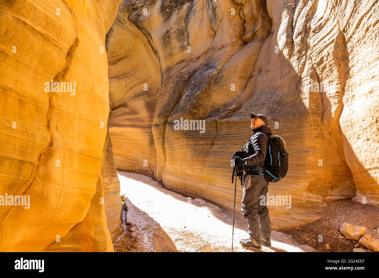 USA, Utah, Escalante, Man hiking in slot canyon in Grand Staircase-Escalante National Monument Stock Photo