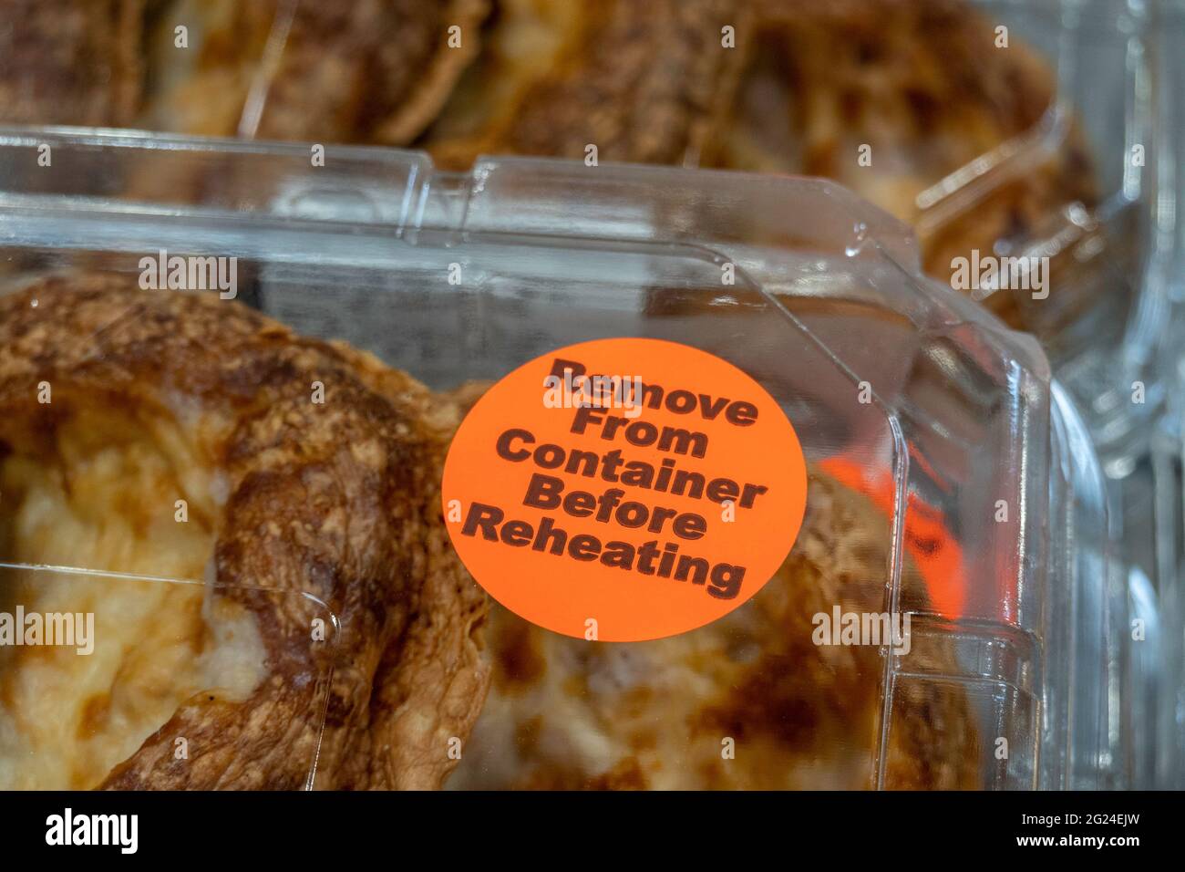 Remove from Container Before Reheating Sticker on baked Goods, USA Stock Photo