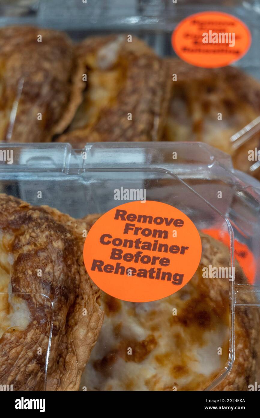 Remove from Container Before Reheating Sticker on baked Goods, USA Stock Photo