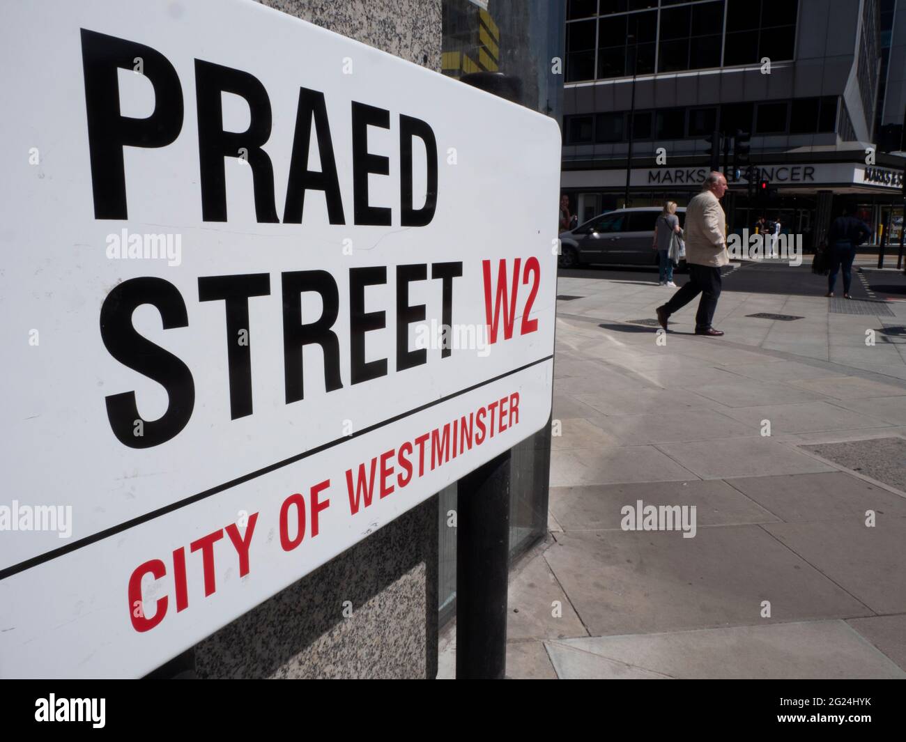 People passing Praed Street, street sign Paddington London Stock Photo