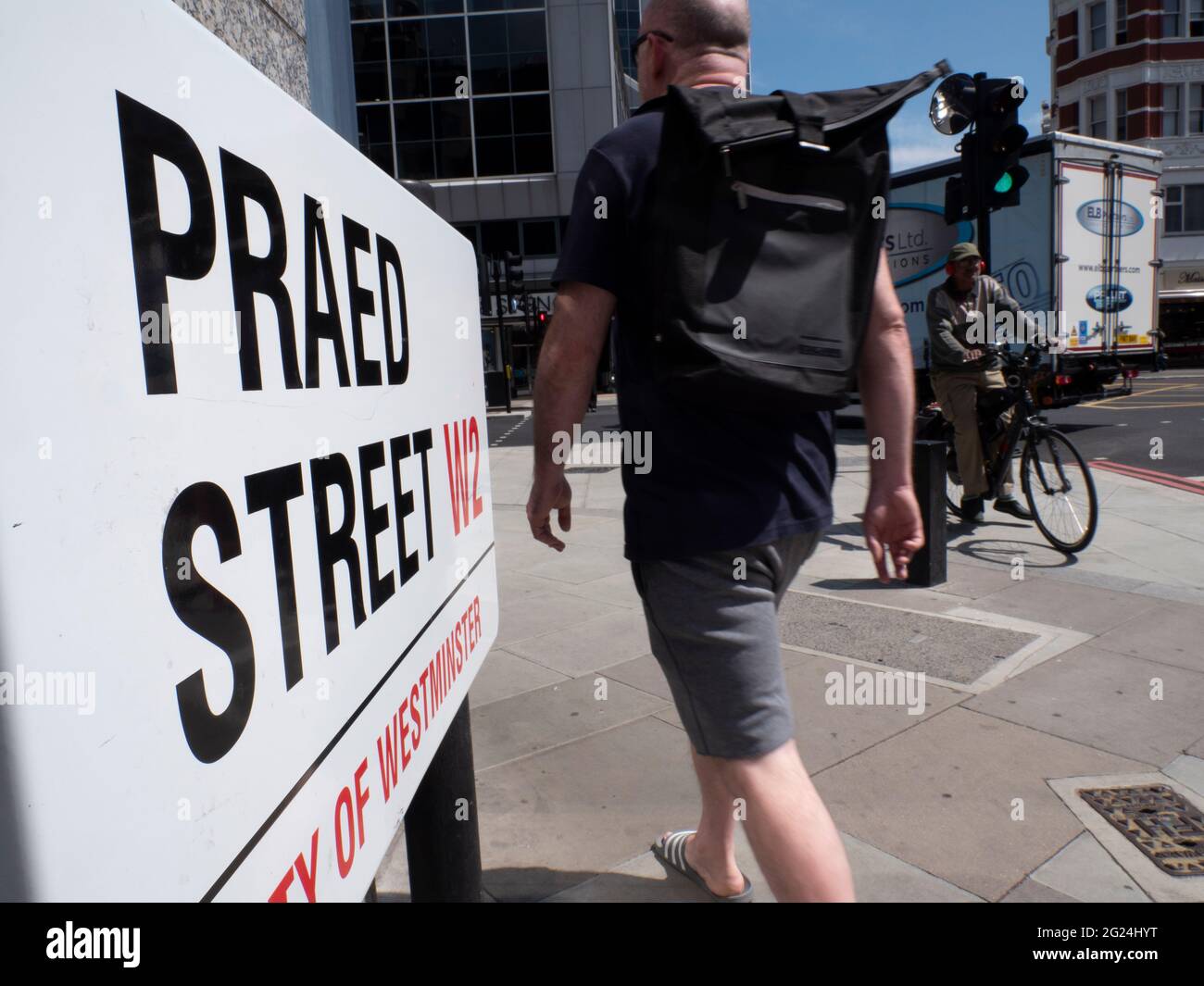 People passing Praed Street, street sign Paddington London Stock Photo