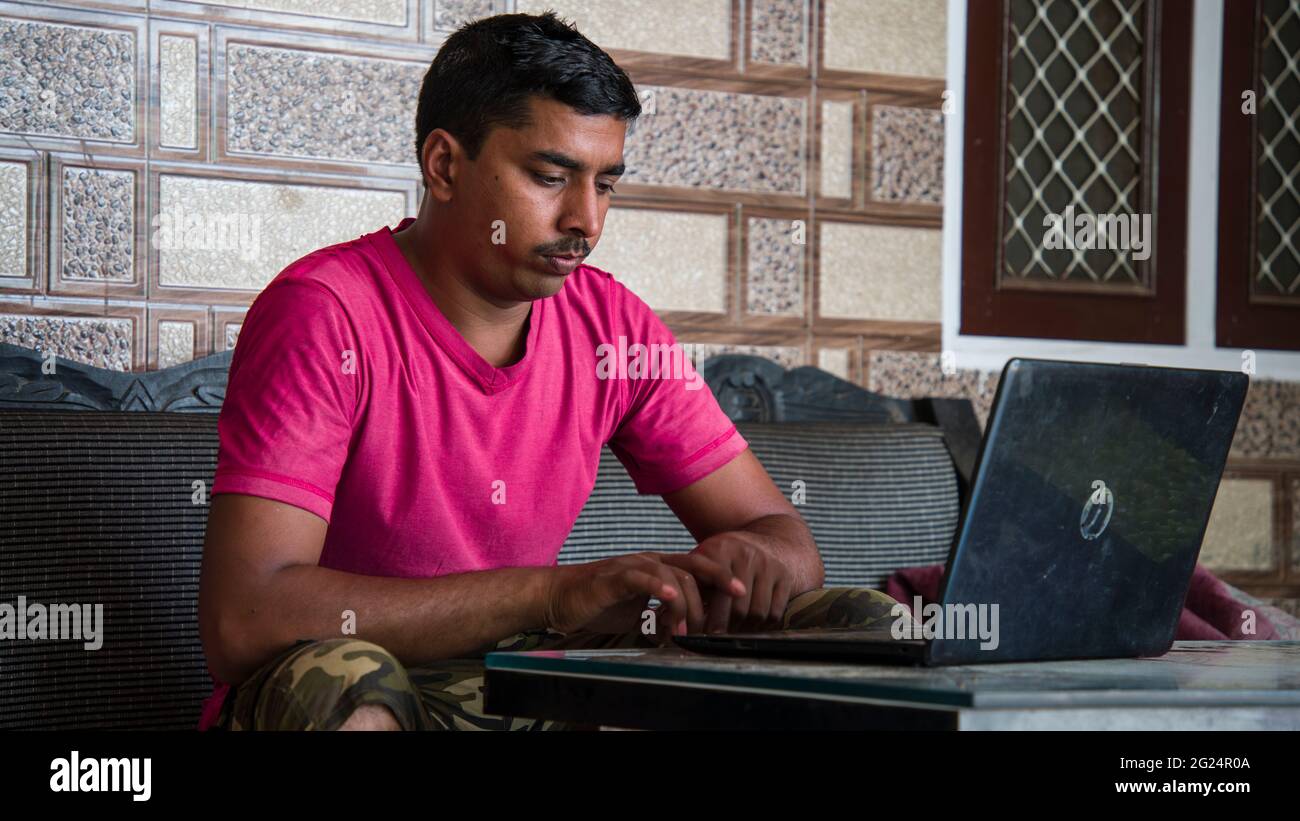 Indian teacher using computer remote studying, virtual training, watching online education at home office. Work from home concept Stock Photo