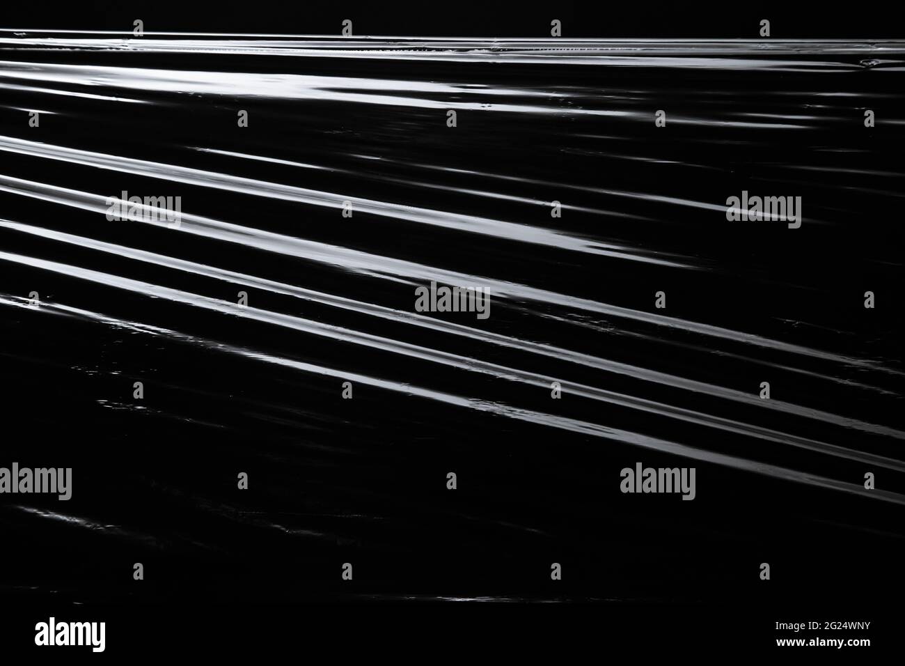 Texture of the plastic wrap on black background Stock Photo