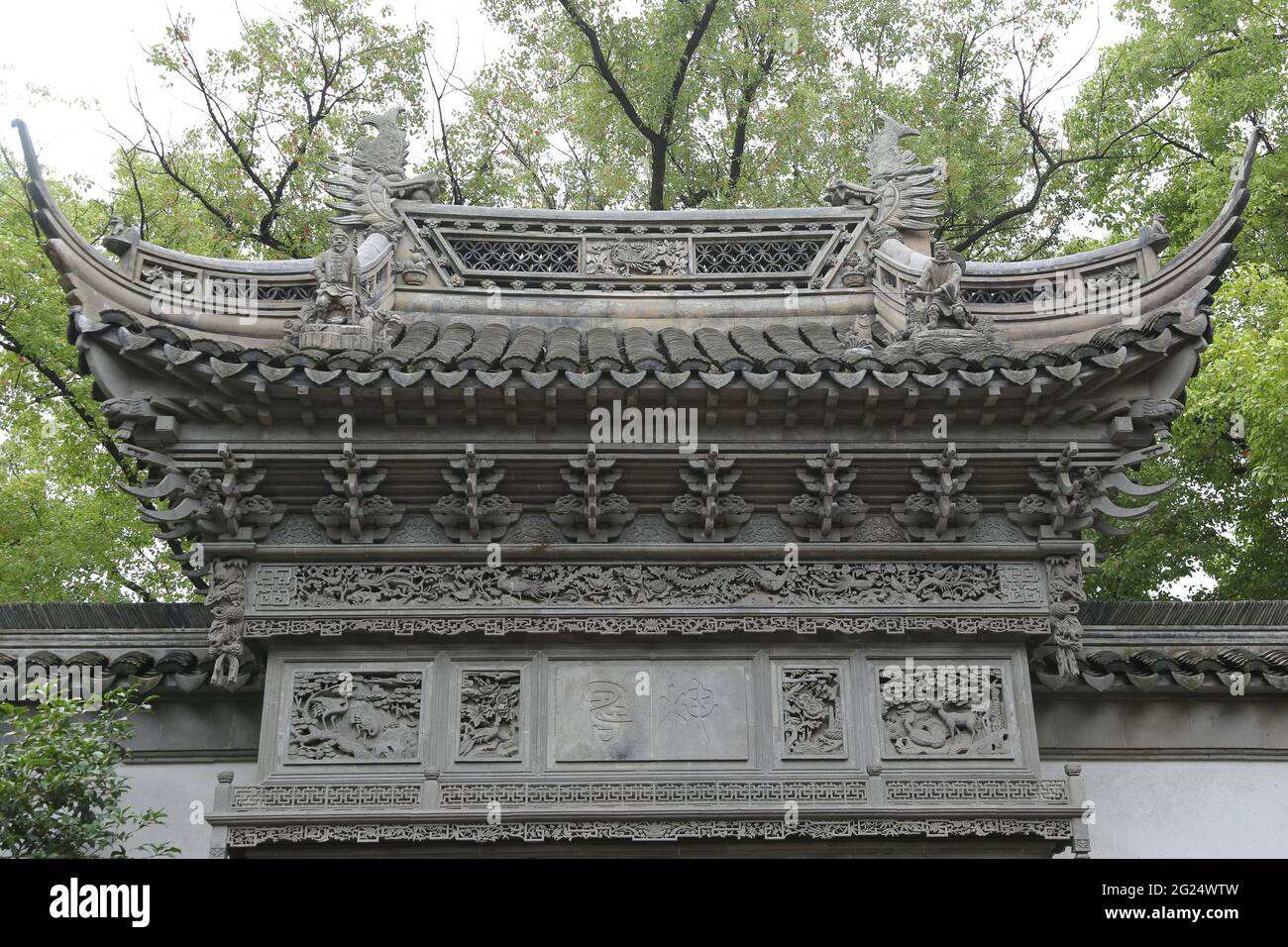 Ornate roof architecture above the yu garden gate hires stock
