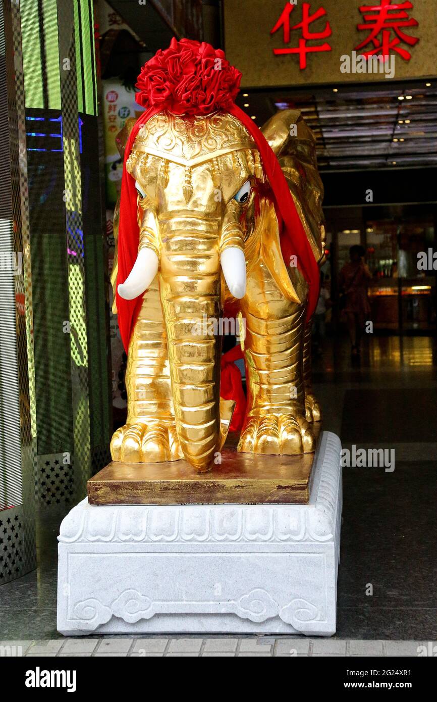 Frontal view of Elephant Statue in Gold on entry to Pearl Village Market, Shanghai, Peoples Republic of China. Stock Photo