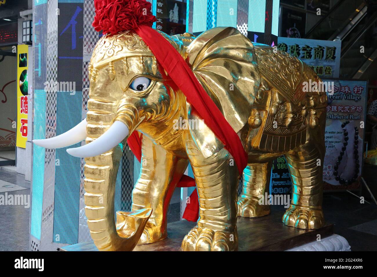 Side view of Elephant Statue in Gold on entry to Pearl Village Market, Shanghai, Peoples Republic of China. Stock Photo