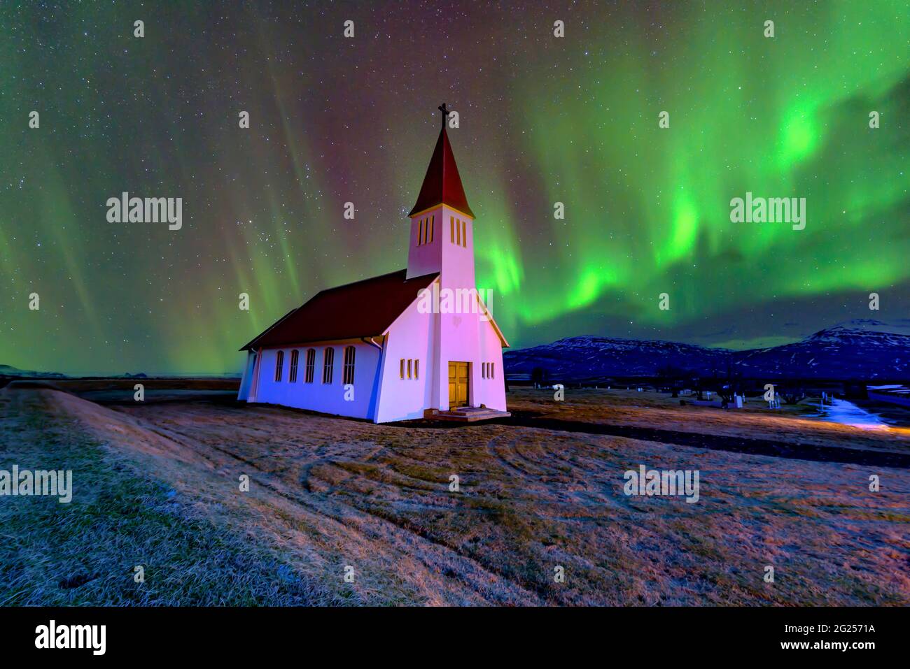 Northern lights over Vikurkirkja church, Vik, Iceland Stock Photo