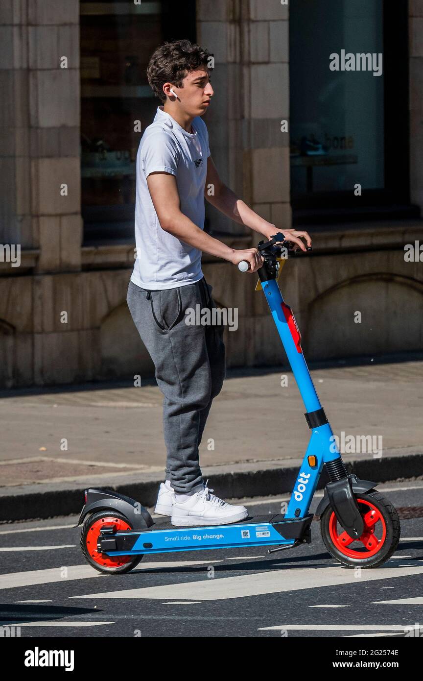 London, UK. 8 Jun 2021. Many continue to break the rules by riding on the  pavement or pedestrian crossings - Electric scooters (e-scooters) are now  available to rent in a small number