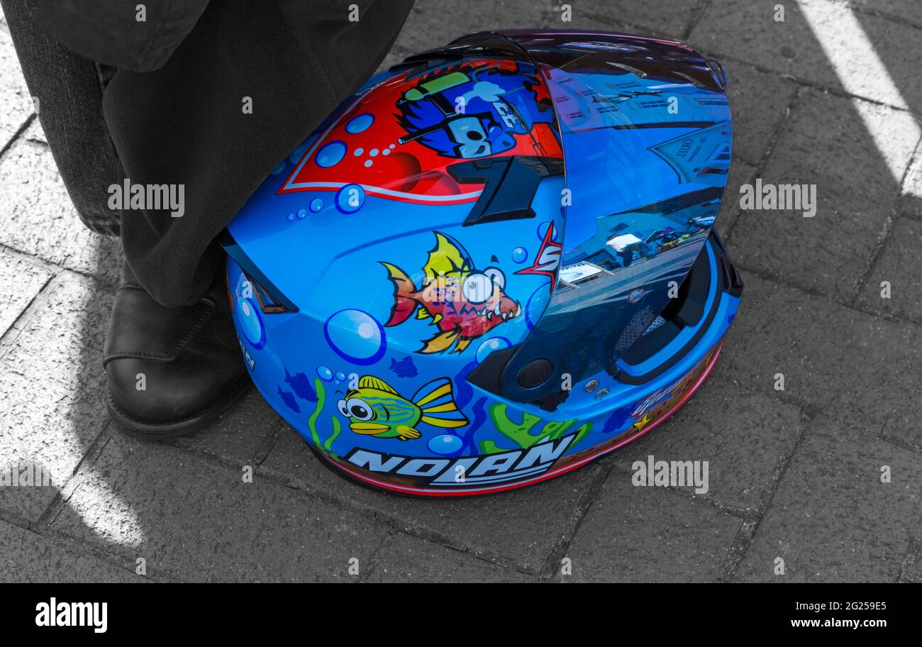 Crash Helmet on ground at Bike Night, Poole Quay, Dorset UK in June