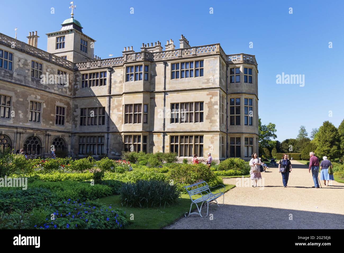 Audley End; people enjoying the 17th century Jacobean Audley End House and Gardens, owned by English Heritage, Audley End, Cambridgeshire UK Stock Photo