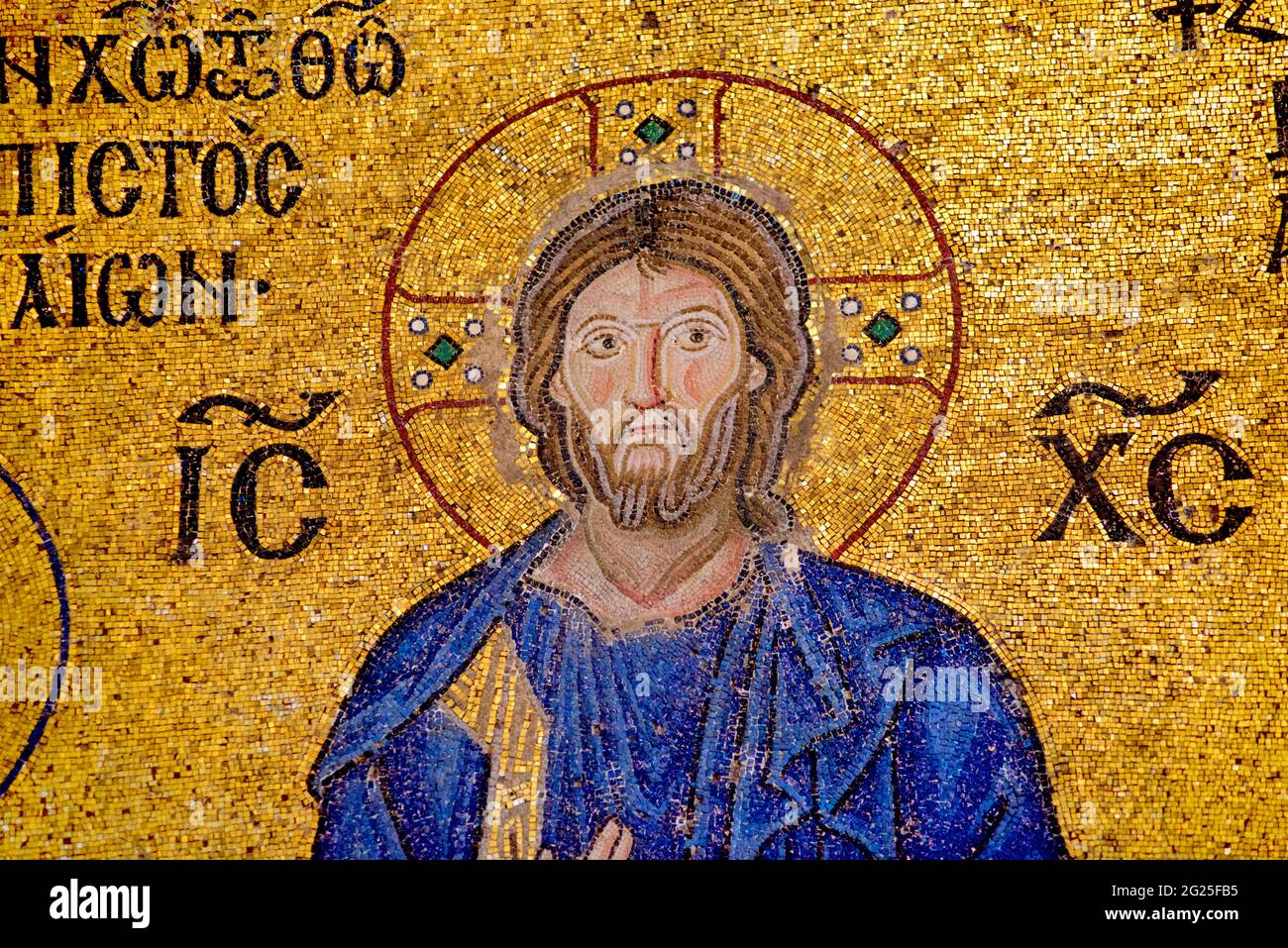 Detail of the Empress Zoe mosaic, Hagia Sophia (Turkish: Ayasofya), Istanbul, Turkey. Christ Pantocrator clad in the dark blue robe, as is the custom in Byzantine art. Byzantine art. Stock Photo