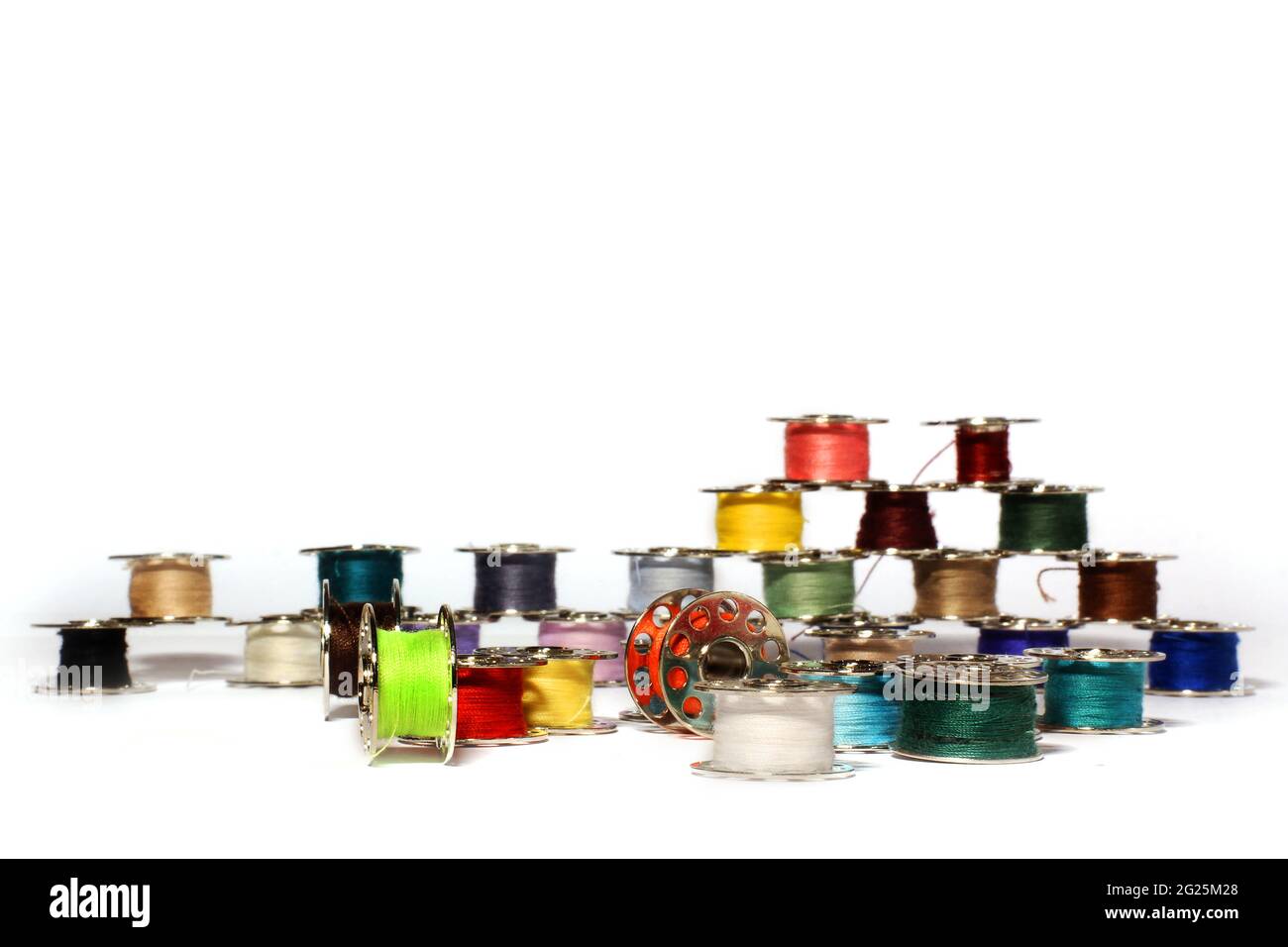 Spools of thread on a white background. For sewing Stock Photo - Alamy