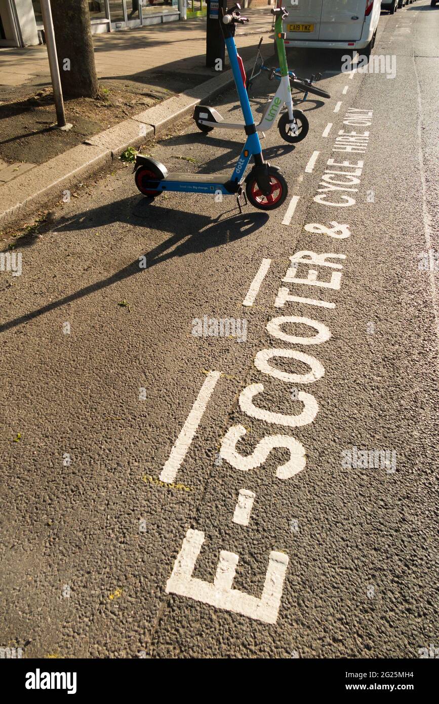 A new parking bay for E scooter / electric scooters for hire on the public road / highway in Twickenham, London. UK. These scooters are legal. (123) Stock Photo