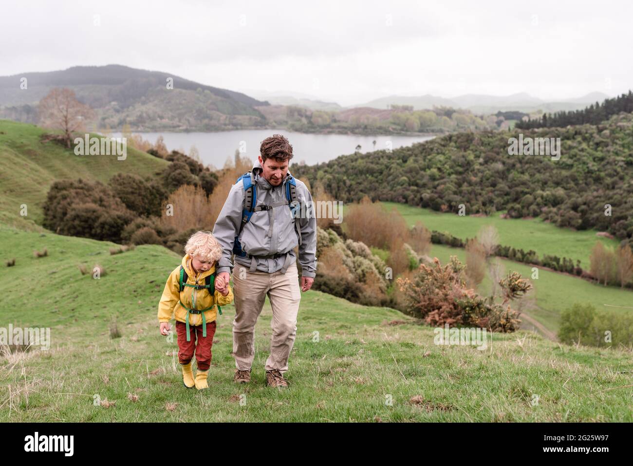 Father and child hiking in New Zealand Stock Photo