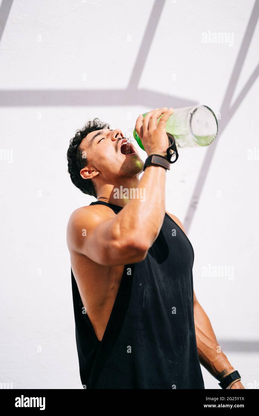 Man drinking water after training Stock Photo