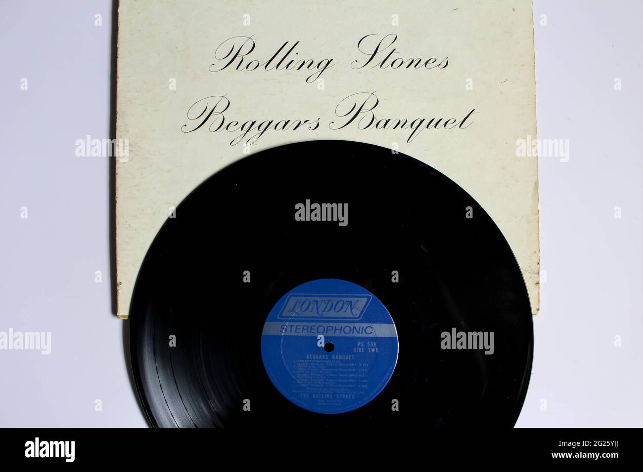 English rock band, The Rolling Stones music album on vinyl record LP disc. Titled: Beggars Banquet album cover Stock Photo