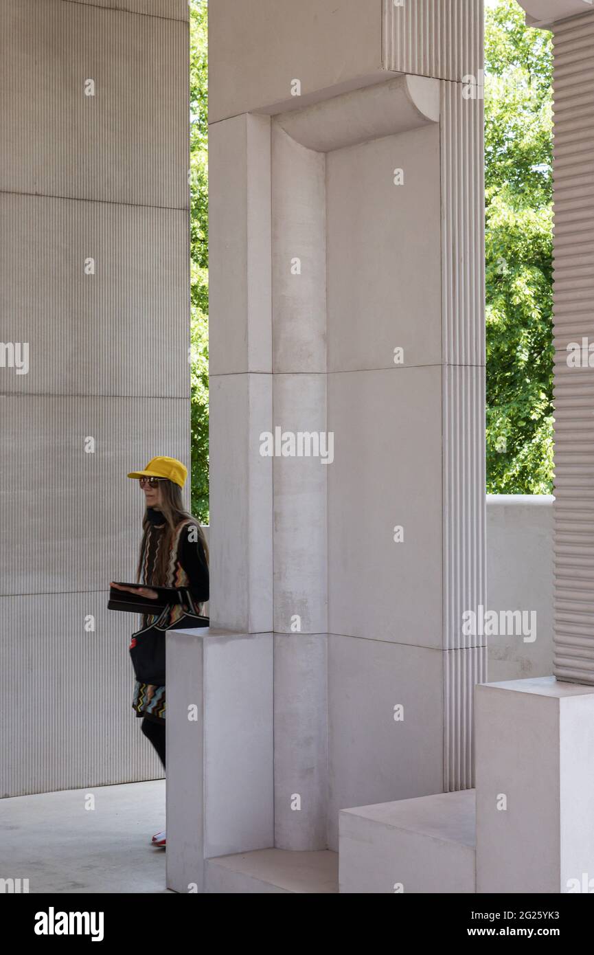 Architectural fragments inspected by visitor. Serpentine Summer Pavilion 2021, London, United Kingdom. Architect: Conterspace, 2021. Stock Photo