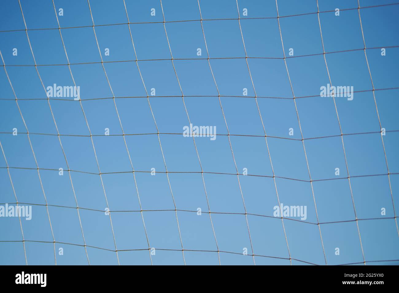 Sport mesh from rope on blue sky background Stock Photo