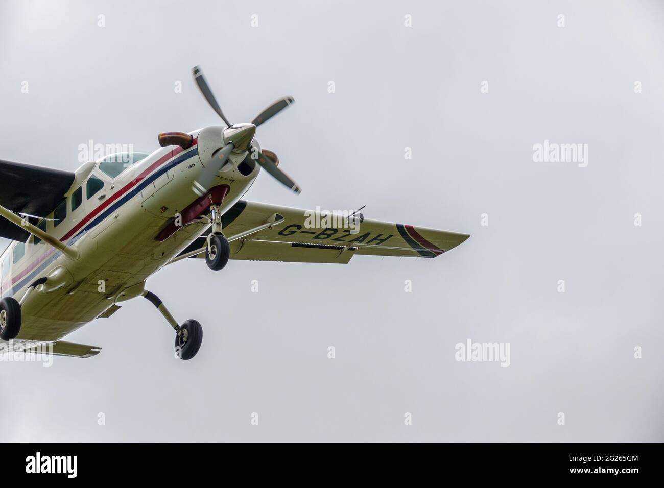 Cessna 208b Grand Caravan light aircraft returning to land after dropping the Red Devils parachute display team on a practice jump Stock Photo