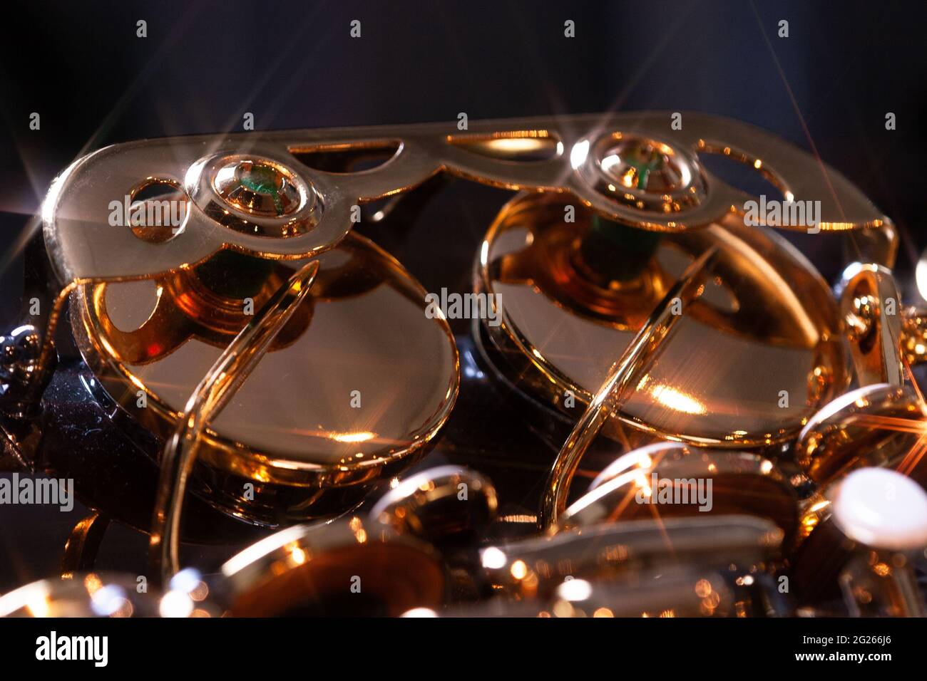 Light reflections on the valves of a brass instrument Stock Photo - Alamy