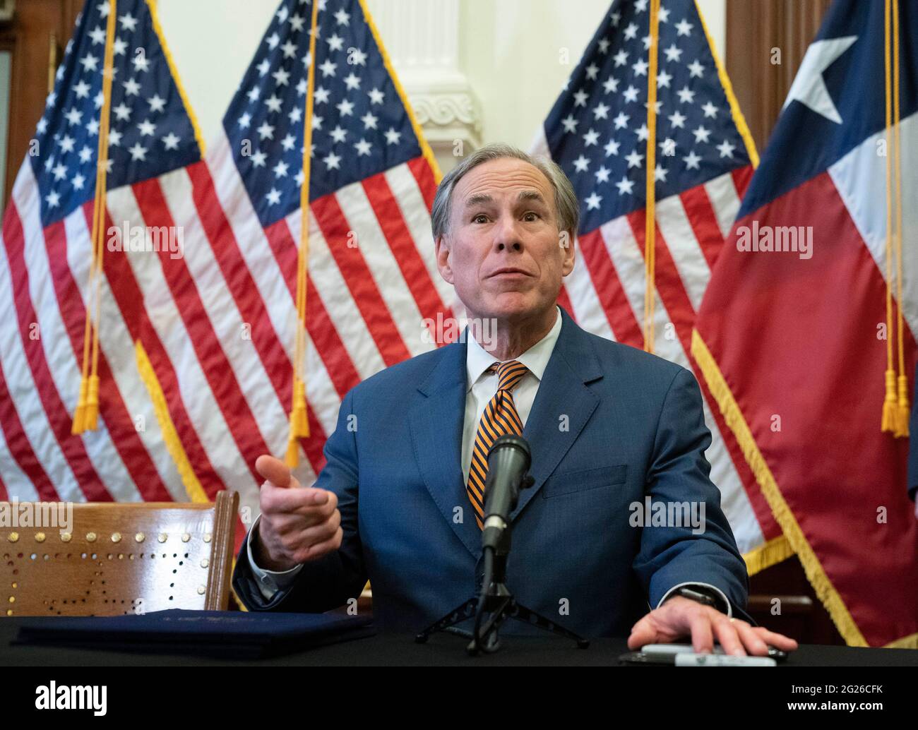 Austin, Texas USA, June 8 2021: Texas Gov. Greg Abbott talks to the press after signing two bills strengthening the Texas power grid and infrastructure that were emergency items on his legislative agenda during the recently completed legislative session. The bills were in response to February's winter storm that nearly knocked out the Texas power grid and left millions of Texans without power for days. Credit: Bob Daemmrich/Alamy Live News Stock Photo