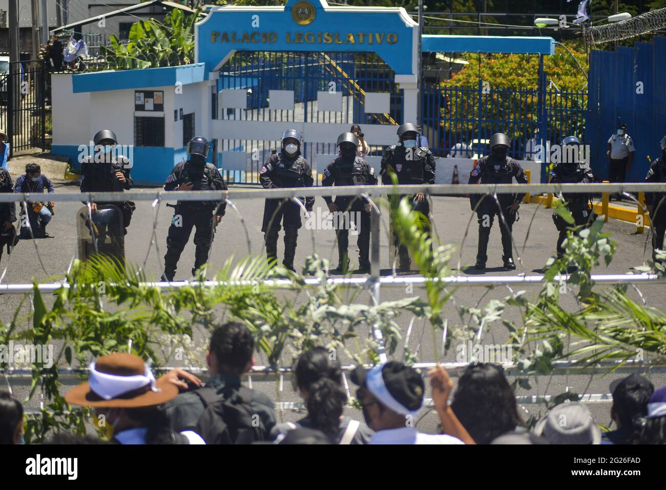 San Salvador, El Salvador. 08th June, 2021. Riot control police officers guard the main entrance into the Salvadoran Legislative Assembly during the demonstration. Members of churches and social movements took to the streets to protest for the environment, the Salvadoran Congress archived hundreds of law protects including several proposal for the environment, including water as a human right. Credit: SOPA Images Limited/Alamy Live News Stock Photo