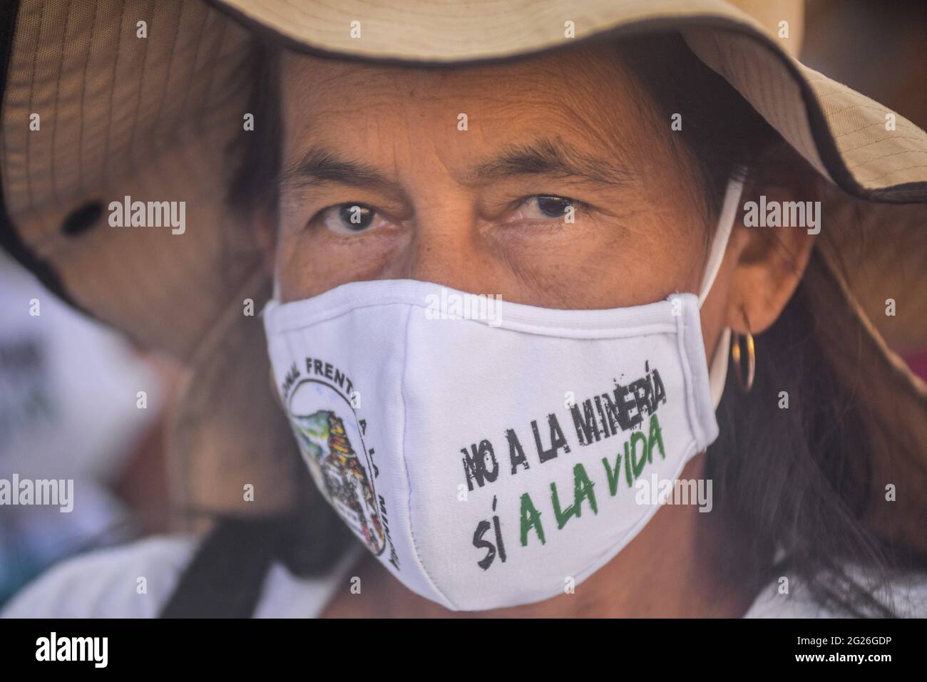 San Salvador, El Salvador. 08th June, 2021. A woman is seen wearing a face mask with a message against mining during the demonstration. Members of churches and social movements took to the streets to protest for the environment, the Salvadoran Congress archived hundreds of law protects including several proposal for the environment, including water as a human right. (Photo by Camilo Freedman/SOPA Images/Sipa USA) Credit: Sipa USA/Alamy Live News Stock Photo